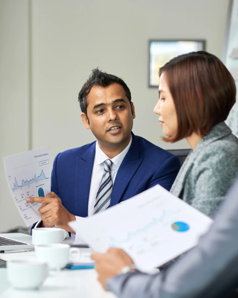 businessman-with-financial-report-at-meeting-2023-11-27-05-04-27-utc